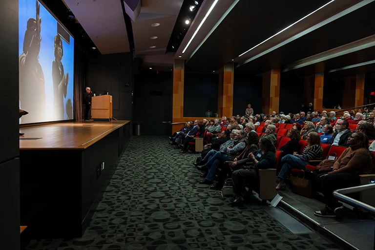 People watching presentation in auditorium