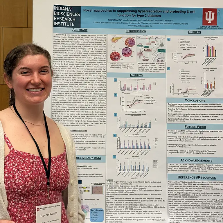 Student standing next to poster for Indiana Biosciences Research Institute